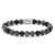 Armband med grå 8 mm-pärlor och rostfritt stållås, Rebel&Rose-logotyp.