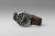 Seiko herrklocka med mörk urtavla, brunt läderarmband och lysande index